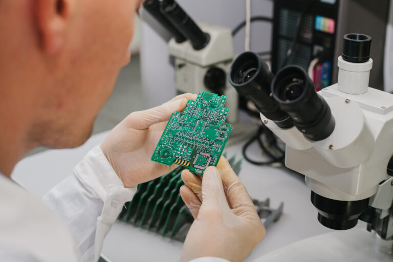 Hand soldering detail work on assembled PCB
